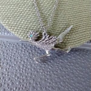 Women's road runner funny silver tone necklace.